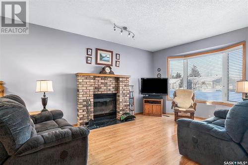 1335 Haslam Way, Saskatoon, SK - Indoor Photo Showing Living Room With Fireplace