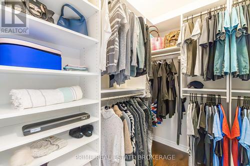 Custom primary walk-in closet - 855 Oakcrossing Road, London, ON - Indoor With Storage