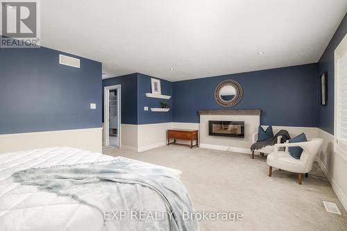 91 Valebrook Street, Kitchener, ON - Indoor Photo Showing Bedroom With Fireplace