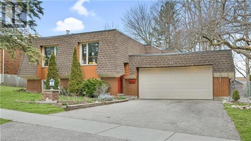 Front facade with roof with shingles, brick siding, and mansard roof - 42 Culpepper Drive, Waterloo, ON - Outdoor