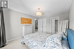 Primary bedroom with a walk-in closet - 