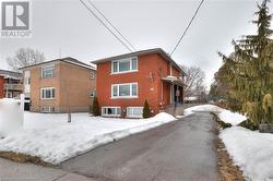 View of snowy exterior with brick siding - 