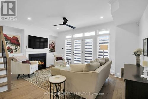 Natural light streams into the living room - 400 Berkley Avenue, Ottawa, ON - Indoor Photo Showing Other Room With Fireplace