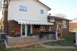 Backyard patio area with awsing and pergola - 