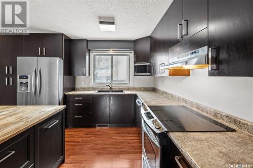 1231 Emerald Crescent, Saskatoon, SK - Indoor Photo Showing Kitchen With Double Sink