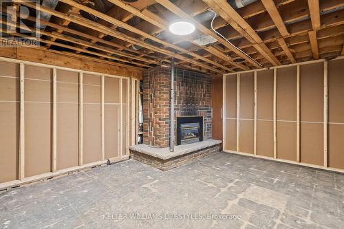 Secondary unit living room - 67 Britannia Avenue, London, ON - Indoor With Fireplace