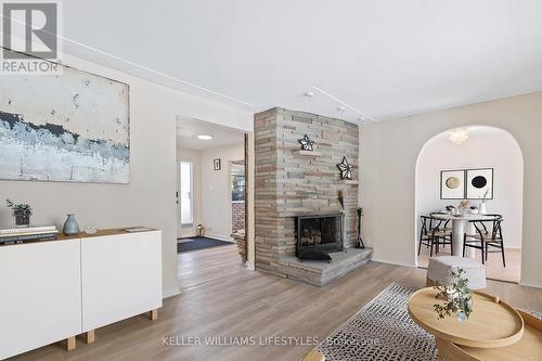 Virtually staged living/dining rooms - 67 Britannia Avenue, London, ON - Indoor Photo Showing Living Room With Fireplace