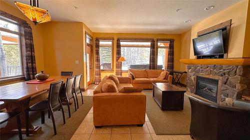 M4-D-1351 Gerry Sorensen Way, Kimberley, BC - Indoor Photo Showing Living Room With Fireplace