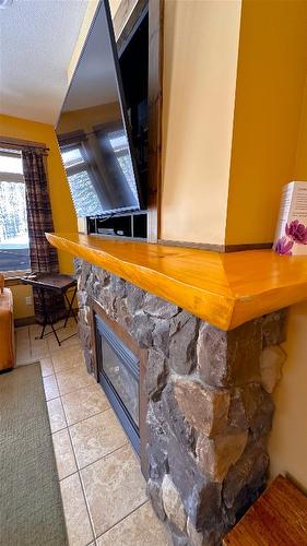 M4-D-1351 Gerry Sorensen Way, Kimberley, BC - Indoor Photo Showing Other Room With Fireplace