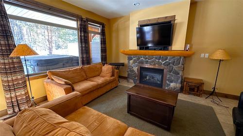 M4-D-1351 Gerry Sorensen Way, Kimberley, BC - Indoor Photo Showing Living Room With Fireplace