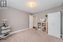 Misc room featuring baseboards and carpet floors - 