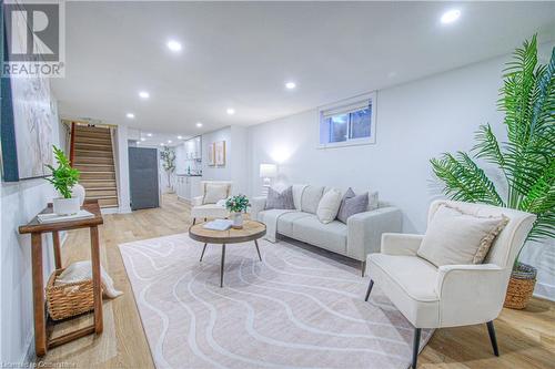 Living room featuring recessed lighting, light wood-style floors, and stairs - 153 Ballantyne Avenue, Cambridge, ON - Indoor Photo Showing Living Room