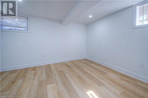 Unfurnished room with recessed lighting, light wood-type flooring, and baseboards - 153 Ballantyne Avenue, Cambridge, ON - Indoor Photo Showing Other Room