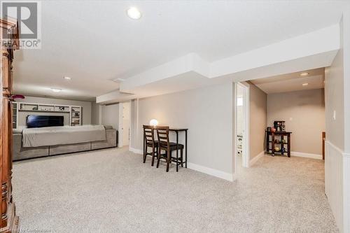 Carpeted living area featuring recessed lighting and baseboards - 598 Coppercroft Court, Waterloo, ON - Indoor