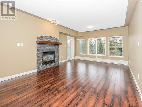 405, 30 Discovery Ridge Close Sw, Calgary, AB - Indoor Photo Showing Living Room With Fireplace