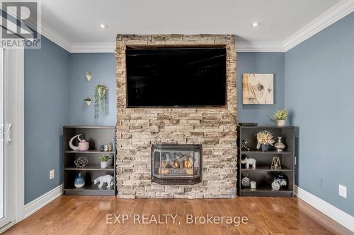 Lower Level Family Room - 935 Lovingston Crescent, Mississauga, ON - Indoor Photo Showing Living Room With Fireplace