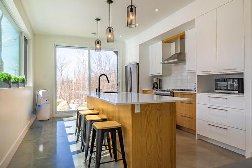 Aerial photo - 14 Ch. Des Colibris, Saint-Hippolyte, QC - Indoor Photo Showing Kitchen With Upgraded Kitchen