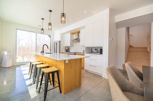 Aerial photo - 14 Ch. Des Colibris, Saint-Hippolyte, QC - Indoor Photo Showing Kitchen With Upgraded Kitchen