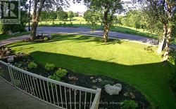 Fully Landscaped Front Yard With Gardens & Lightin - 