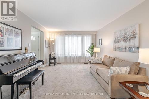 Guests are welcomed by a bright, cozy living room - 2000 Silverberry Crescent, Mississauga, ON - Indoor Photo Showing Living Room