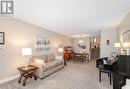 The broadloom covers a beautiful classic hardwood - 2000 Silverberry Crescent, Mississauga, ON  - Indoor Photo Showing Living Room 