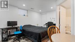 Bedroom with recessed lighting, a closet, visible vents, and wood finished floors - 