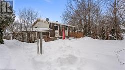 View of front of home featuring fence - 