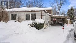 View of snow covered property - 