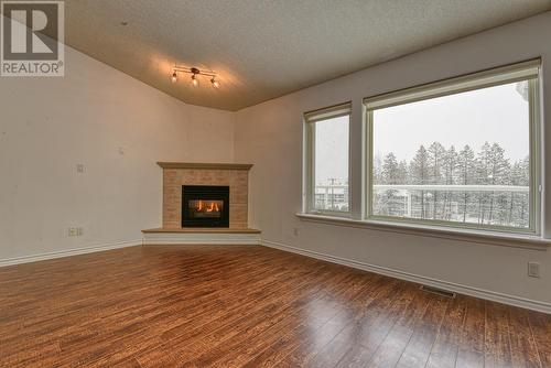 9 11 Eagle Crescent, Williams Lake, BC - Indoor Photo Showing Living Room With Fireplace