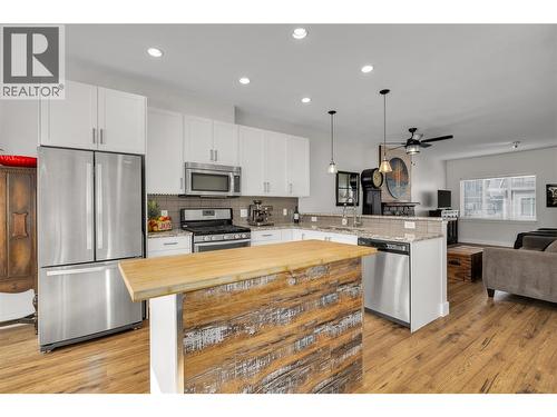 A functional butcher block island countertop! - 600 Sherwood Road Unit# 55, Kelowna, BC - Indoor Photo Showing Kitchen With Stainless Steel Kitchen With Upgraded Kitchen