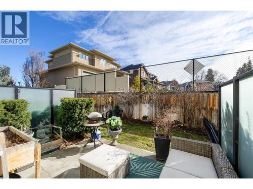 A lovely enclosed yard, a perk that not every unit in this complex has! - 600 Sherwood Road Unit# 55, Kelowna, BC - Outdoor With Deck Patio Veranda