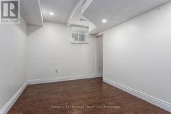 Basement, bedroom with hardwood flooring - 