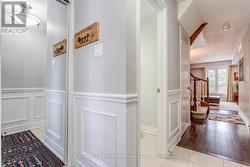 Front entrance, hall closet,  wainscoting - 