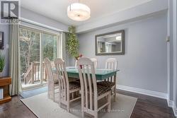 Dining room with sliders to the back deck. - 