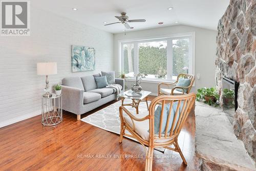 Family Room With Large Window, Electric Fireplace - 1169 Wildfield Crescent, Mississauga, ON - Indoor Photo Showing Living Room With Fireplace