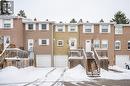 View of property featuring a garage, brick siding, and stairway - 212 Westcourt Place, Waterloo, ON  - Outdoor With Facade 