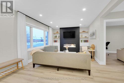 Cozy livingrm,a fireplace,custom window coverings - 550 Donald Street, Ottawa, ON - Indoor Photo Showing Other Room With Fireplace