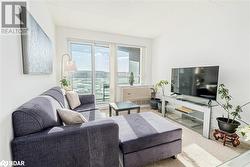 Living room featuring baseboards and visible vents - 