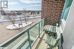 Snow covered back of property with a residential view - 