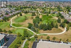 Drone / aerial view with a residential view and golf course view - 