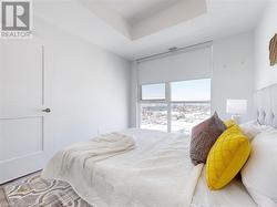 Bedroom featuring a tray ceiling - 