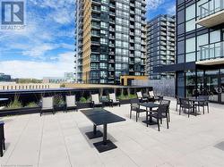 View of home's community with a view of city and a patio - 