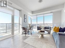 Living area with visible vents and wood finished floors - 