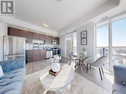 Living area with light wood-type flooring, a healthy amount of sunlight, visible vents, and recessed lighting - 