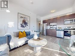 Living area featuring recessed lighting and light wood-style floors - 