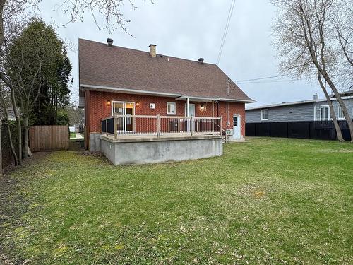 Face arrière - 18 Rue Marie-Antoinette, Blainville, QC - Outdoor With Above Ground Pool With Deck Patio Veranda