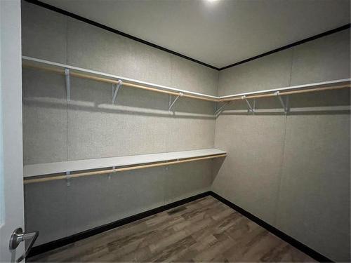 Walk in closet - E10 1545 Main Street E, Swan River, MB - Indoor With Storage