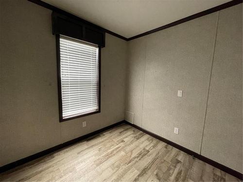 Bed/ #2 - E10 1545 Main Street E, Swan River, MB - Indoor Photo Showing Other Room