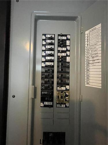 200 amp electrical Panel - E10 1545 Main Street E, Swan River, MB - Indoor Photo Showing Other Room