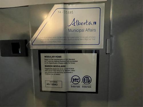 CSA Sticker - E10 1545 Main Street E, Swan River, MB -  Photo Showing Other Room